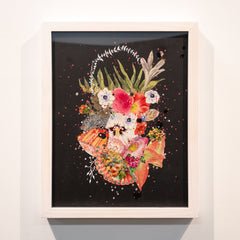 Framed analog collage artwork with a colorful floral design on a black background