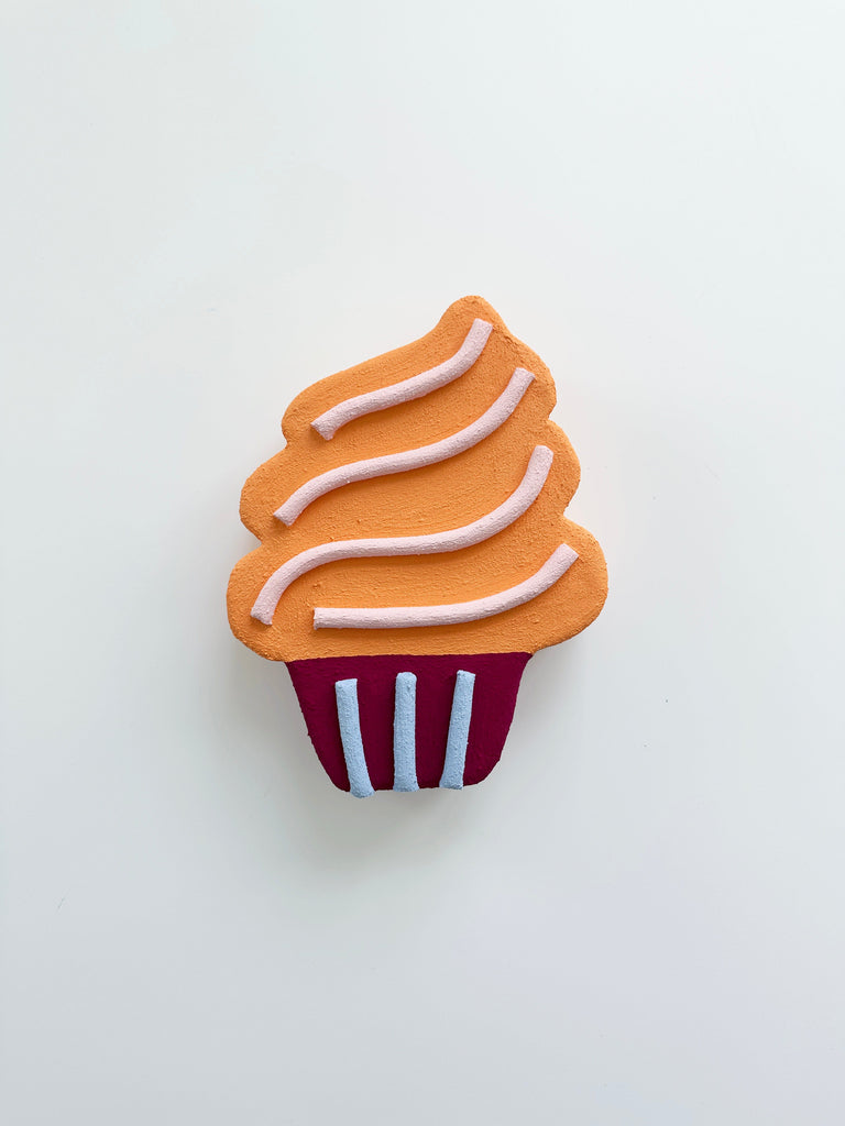 Cupcake wall art sculpture in tones of orange and burgundy
