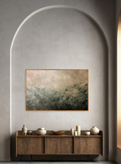 Abstract landscape painting on a wall above a wooden console table with decorative items.