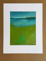 Abstract artwork with blue and green colors on unstretched canvas with white mat