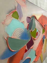 Abstract art piece with colorful geometric shapes on a textured surface
