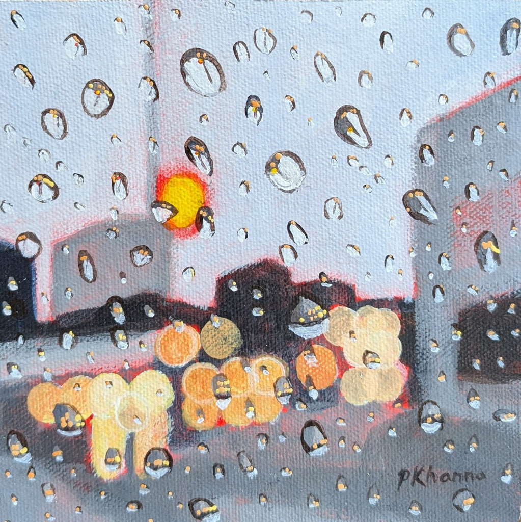 A square acrylic painting of a rainy city street viewed through raindrops, with blurred lights and a small glowing sun or moon in the background. The artist's signature 'pKhanna' is visible in the lower right corner.