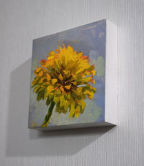 Painting of a yellow flower on a gray wall