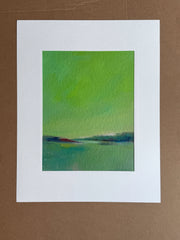 Abstract art unstretched canvas painting with green and blue colors with a white mat. 