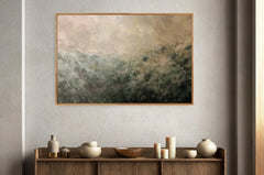 Framed abstract painting on a wall above a wooden console table with decorative items.