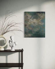 Abstract painting on a wall above a shelf with decorative items