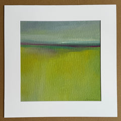 Abstract painting with green and blue hues in a white mat.
