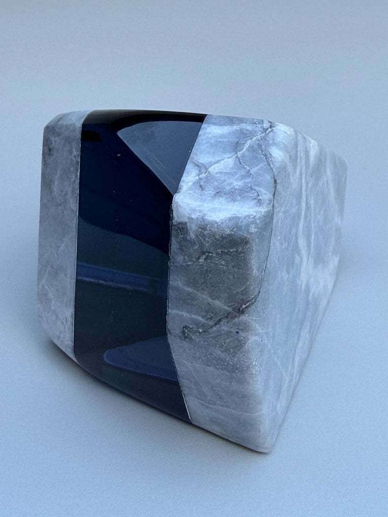 Polished stone with a blue interior on a white background
