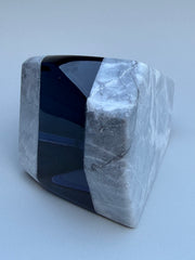 Polished stone with a blue interior on a white background