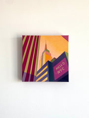 Canvas painting original artwork with a stylized cityscape and 'Hello NYC' text on a white wall.