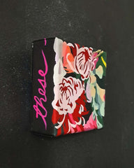 Small rectangular original painting on canvas with floral design and 'these' text on a black background
