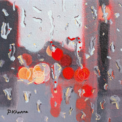 Abstract painting of a blurred cityscape in the background and raindrops. 