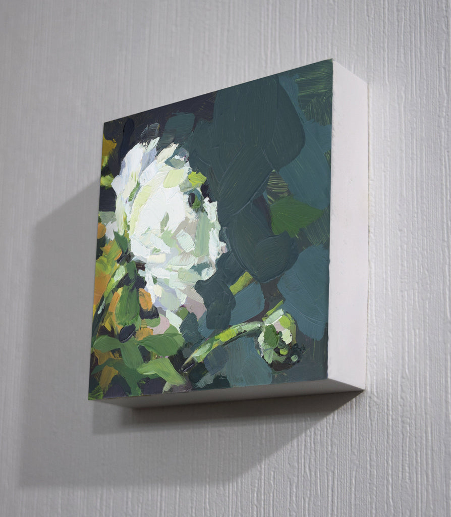 Abstract painting of a flower on a textured wall