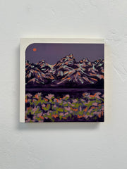 Painting of a mountain landscape with flowers on a textured white wall.