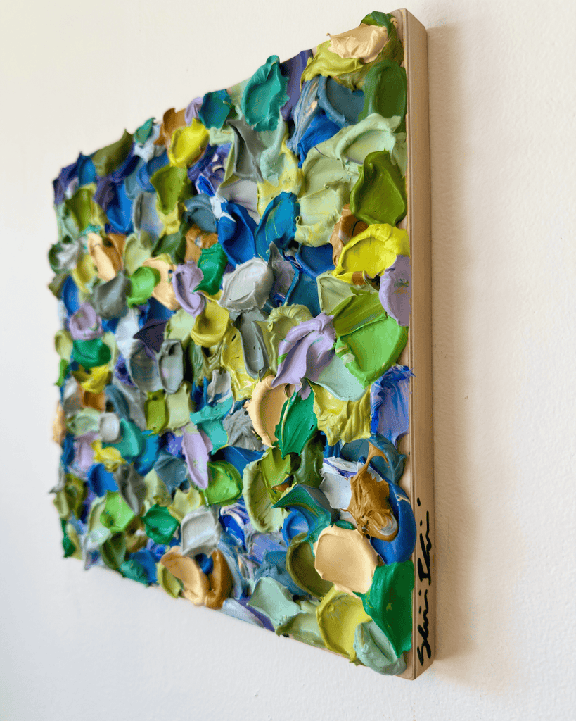 Colorful abstract wall art piece shown in context on a wall by Shiri Phillips