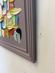 Colorful abstract art piece on a textured wall