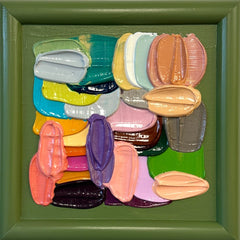 Multicolored abstract brushstrokes arranged in a grid on a green background. Affordable original art.