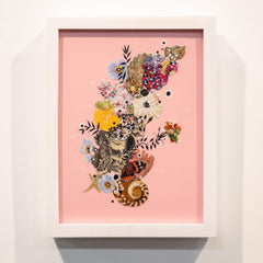 Framed artwork with a colorful collage of flowers and butterflies on a pink background