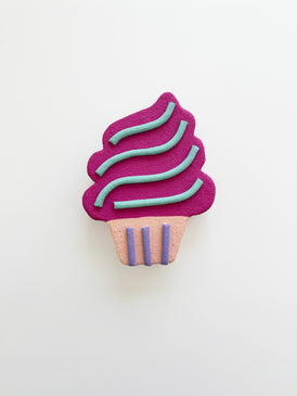 Purple cupcake wall art with pink base on a white background