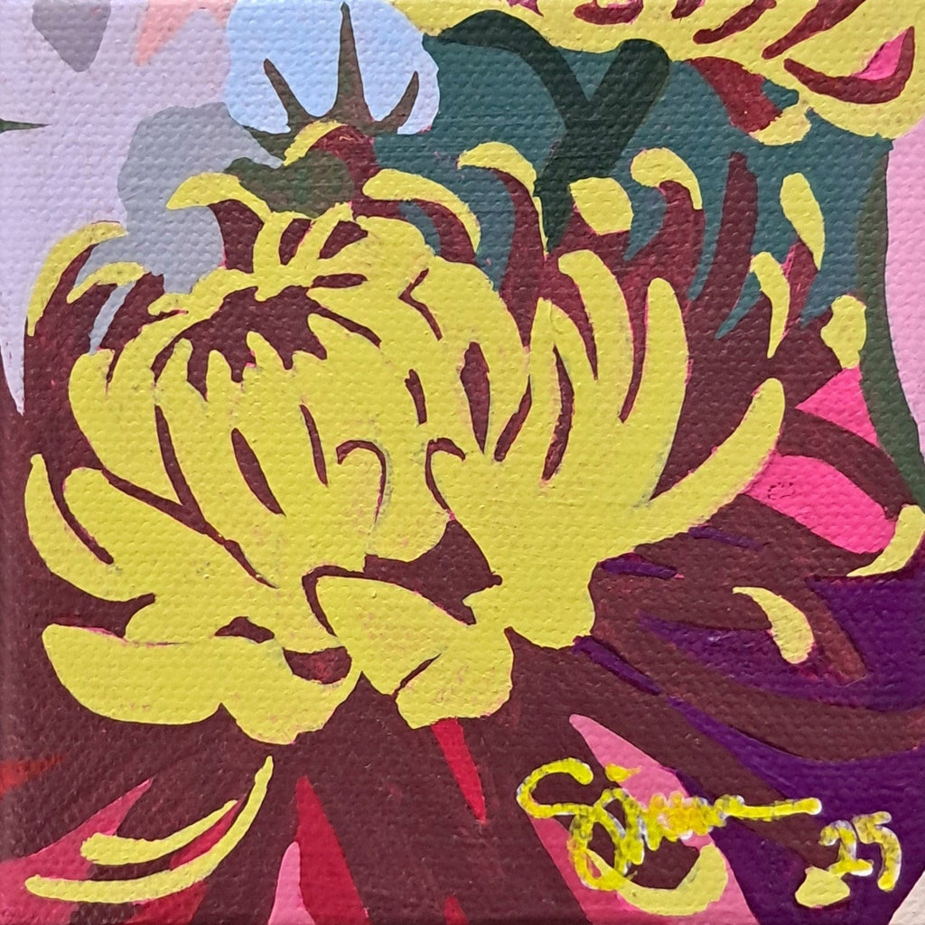 Colorful abstract artwork with a prominent yellow flower-like shape on canvas